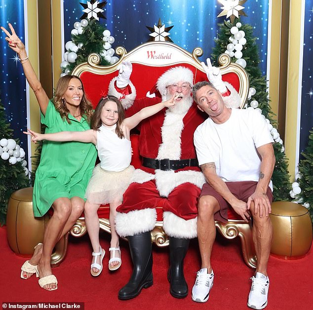 In December, Michael reunited with his ex-wife Kyly at Christmas time.  They posed for a Santa photo with their daughter Kelsey Lee, eight.  All pictured
