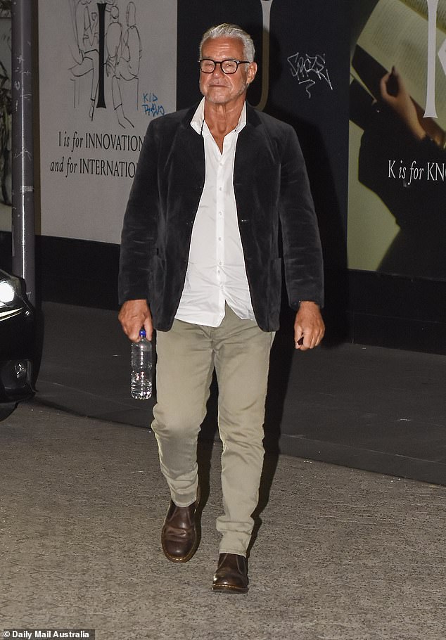 Richard was spotted arriving later looking dejected in a dark velvet blazer over a crisp white shirt
