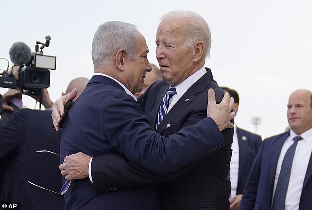 Biden is greeted by Israeli Prime Minister Benjamin Netanyahu after arriving at Ben Gurion International Airport on October 18, 2023 in Tel Aviv