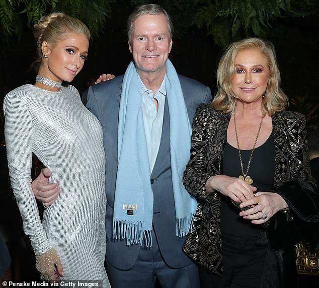 Now Paris defended her father, slamming Mauricio for 'using the Hilton name every chance he gets to plug his crappy show'; she is pictured with her parents Rick and Kathy