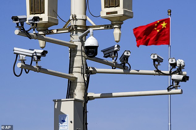 US President Joe Biden last month tasked the Commerce Department with investigating whether Chinese cars were collecting data on drivers and passengers with their cameras and sensors to record detailed information about US infrastructure (pictured are surveillance cameras at Tiananmen Square in Beijing)