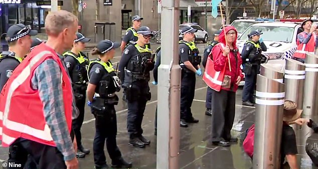 A heavy police presence forced protesters off the roads and onto the footpath on Wednesday