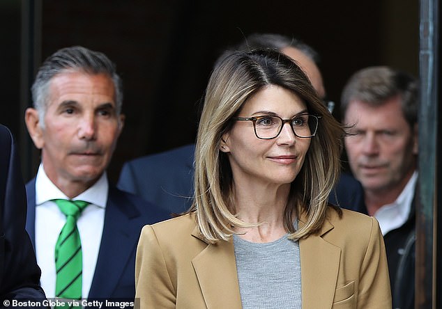 Loughlin - seen here outside a Boston court in April 2019 - served two months for the same scheme