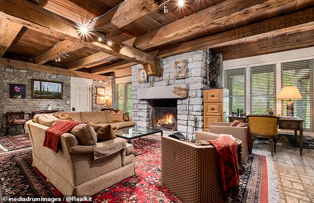 An Amish stone fireplace adorns the living area