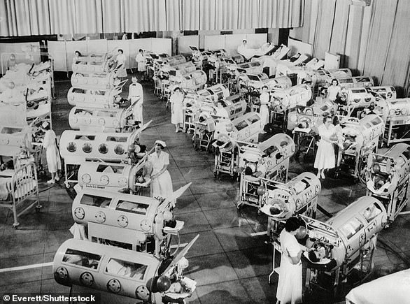 File photo of a 1950s ward full of iron lung patients in the midst of the US polio outbreak