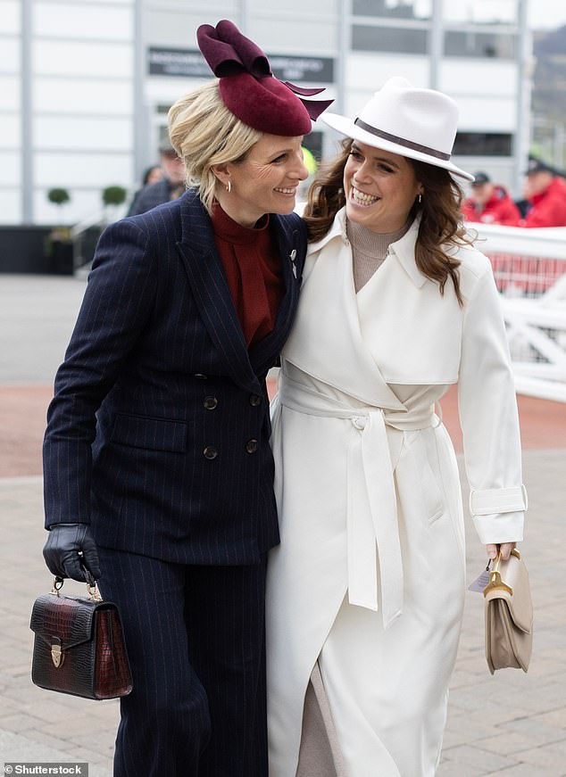 Pictured: the two cousins ​​cuddled up as they entered the races at Cheltenham this afternoon