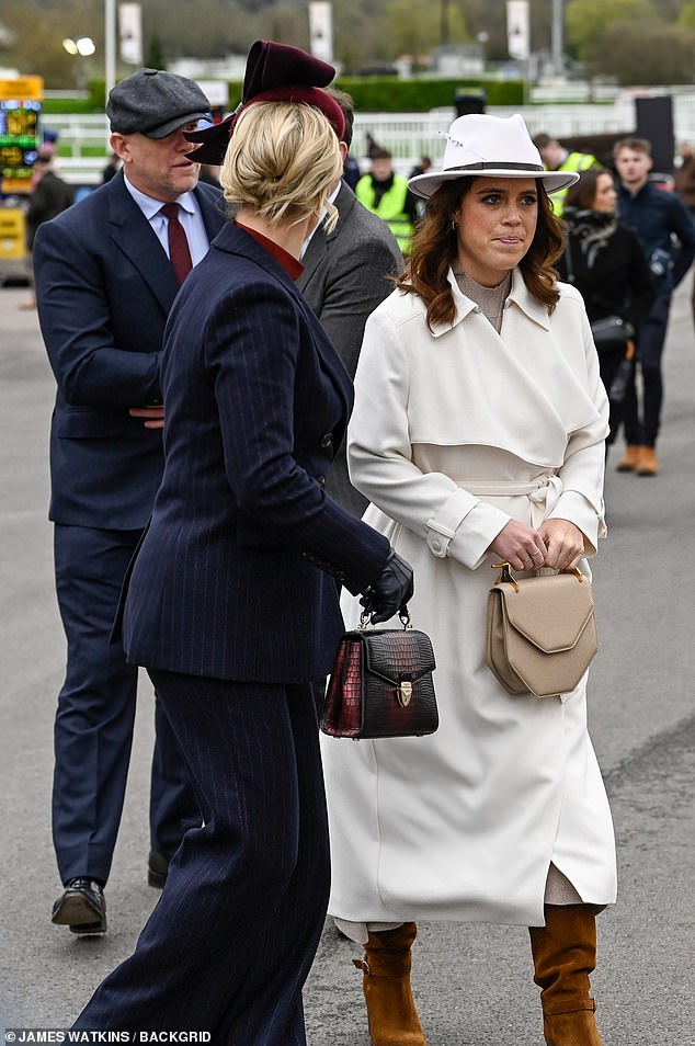 Arriving at the racecourse, Eugenie posed for pictures with husband Jack Brooksbank - who was dressed in a light gray suit and green tie