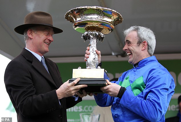 Among his most famous wins was with Hurricane Fly in the Champion Hurdle Challenge Trophy in 2011 and 2013 (pictured with jockey Ruby Walsh after his 2011 win).