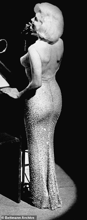 Marilyn in the dress, which was based on a Bob Mackie sketch for costume designer Jean-Louis. Pictured on 19 May 1962 on stage singing Happy Birthday Mr. President at his 45th birthday party in NYC