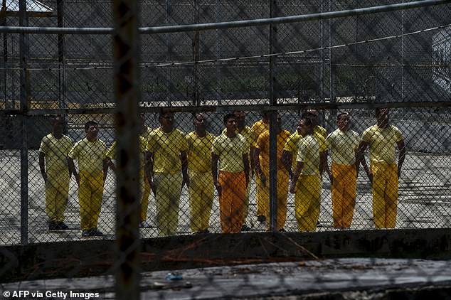 Inmates receive military training in a section of El Rodeo prison near Caracas on July 1, 2016