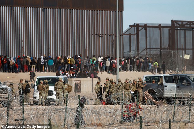 Groups of migrants of various nationalities arrive at the Rio Grande to cross it and surrender to US authorities on March 5 in El Paso, Texas