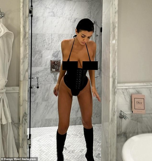 The designer has been pictured in a number of racy outfits since she started dating the rapper, but Kim is 'appreciative' that she 'layers up more' when the children are around