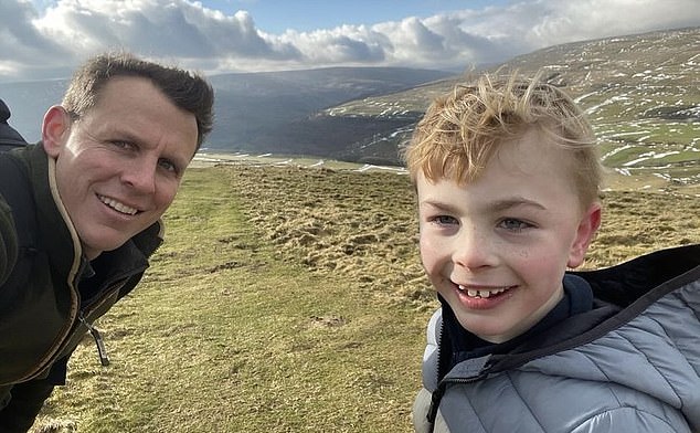 Arthur is pictured with his father, Henry, on Buckden Pike in the Yorkshire Dales.