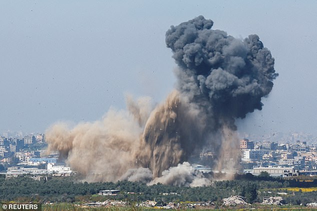 Smoke rises from an explosion in Gaza amid the ongoing conflict between Israel and the Palestinian Islamist group Hamas, as seen from Israel, March 13, 2024