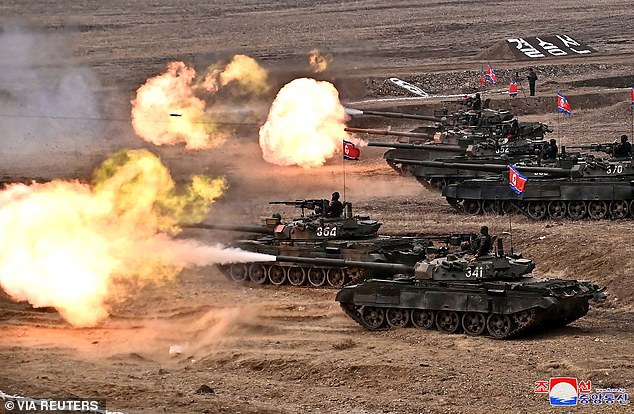 Tanks firing during the military demonstration attended by Kim Jong Un