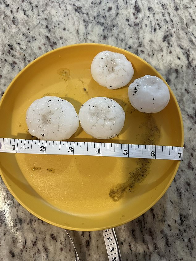 Photos and video emerging from the region capture hand-sized hail as the tornado touched down in north-central Kansas