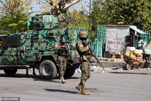 Police officers patrol as Haiti remains under a state of emergency due to the violence, in Port-au-Prince, Haiti, pictured Saturday