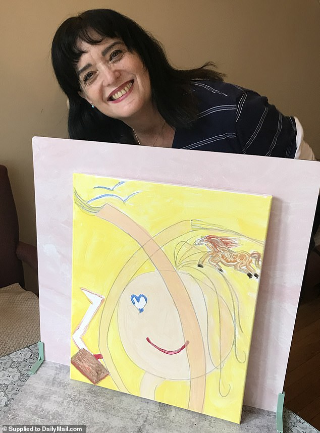 For Judith (pictured with her artwork) there is no reason to celebrate the release as she continues to worry about her family and every hostage held by Hamas