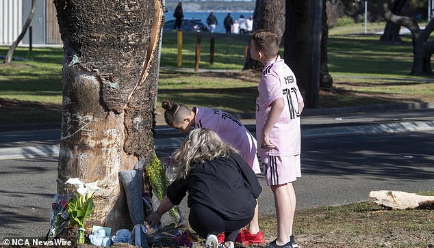 People are pictured leaving flowers at the Monterey tragedy in Sydney's south
