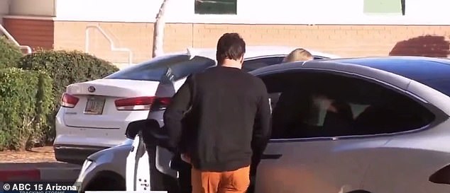 As the pair got to their white Model X Tesla, Becky grabbed her Louis Vuitton bag and Travis made a bold choice to wear bright orange trousers