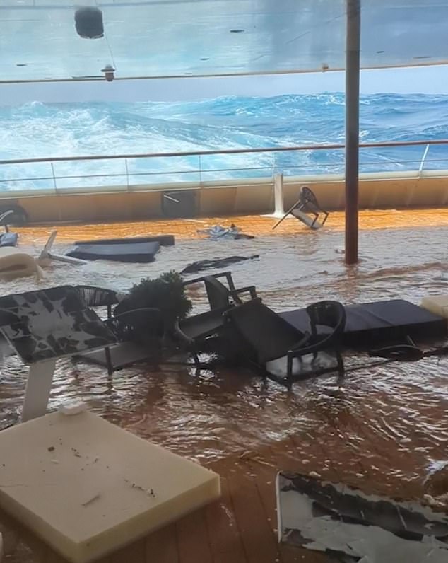 Tables, chairs, sun loungers and all kinds of debris were seen floating after the deck was invaded by the deluge.