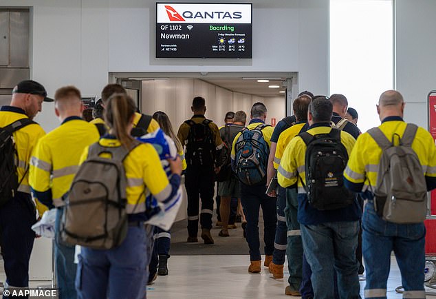 Both high school leavers and young Australians get FIFO jobs instead of going to university (pictured, FIFO miners boarding flight to Newman, Western Australia)