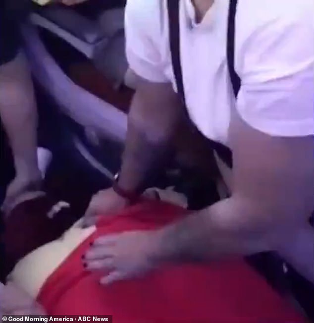 Fifty passengers were injured in the chaotic scenes, with 13 hospitalized with head and neck injuries and broken bones.  An injured person on the plane is pictured