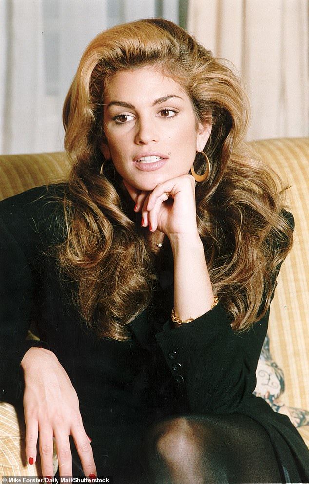 Woodall, 60, showed off his black Valentino suit and tie outfit with his hair slicked back in a video online.  She explains that it's a tribute to one of supermodel Cindy Crawford's (pictured) memorable looks from the 1990s