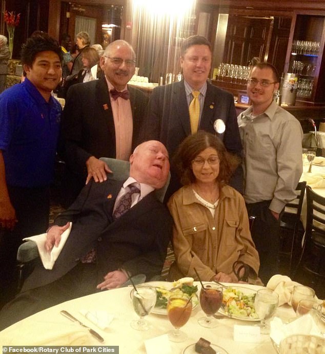 Paul Alexander (front, left) with Kathy Gaines (front, right) at the Rotary Club of Park Cities in 2014 for World Polio Day, where Paul shared his story of life in an iron lung