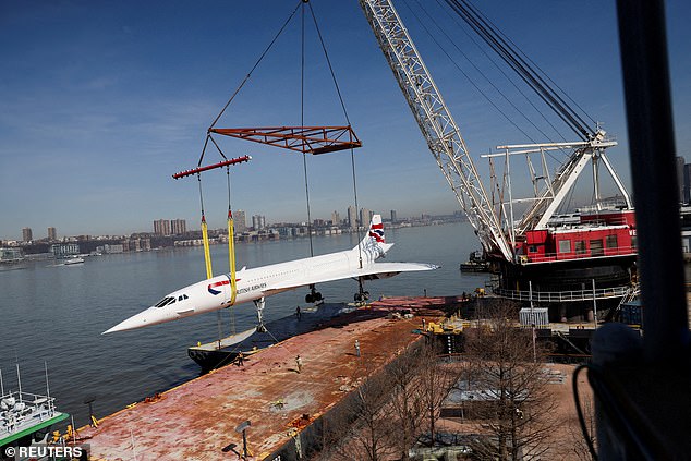 Upon arrival, the jet was photographed with cables and a 300ft crane carefully placing it back into place on the pier