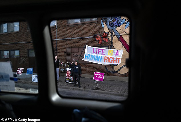 Anti-abortion protesters outside as the vice president's motorcade arrived at the Planned Parenthood clinic in Minnesota