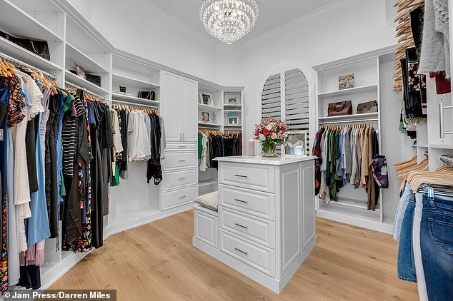 A massive walk-in closet sits just steps away from the master bedroom