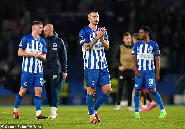 Lewis Dunk applauds the fans after Brighton saved some pride with a 1-0 win that night