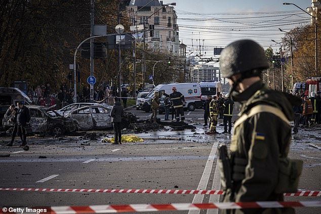 Emergency personnel attend the scene of an explosion on October 10, 2022 in Kiev, Ukraine