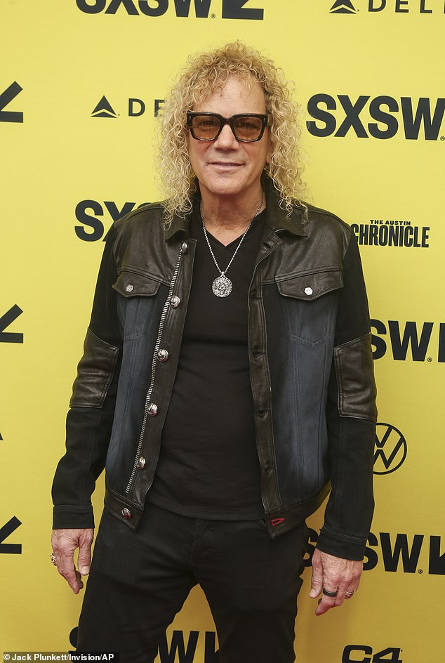Keyboard player David Bryan rocked out in a black leather and denim jacket with matching T-shirt and jeans