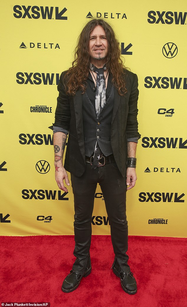 Phil X, who took over guitar duties after Richie Sambora's exit, wore a skinny black suit and pin-striped vest with ragged black trousers and matching boots