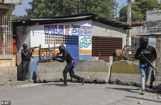 National police patrol the area near the empty national prison after a small fire inside the prison in downtown Port-au-Prince, Haiti, Haiti, Thursday, March 14, 2024