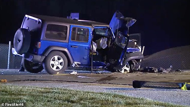 The Wolfe family's blue Jeep is seen after the collision last December