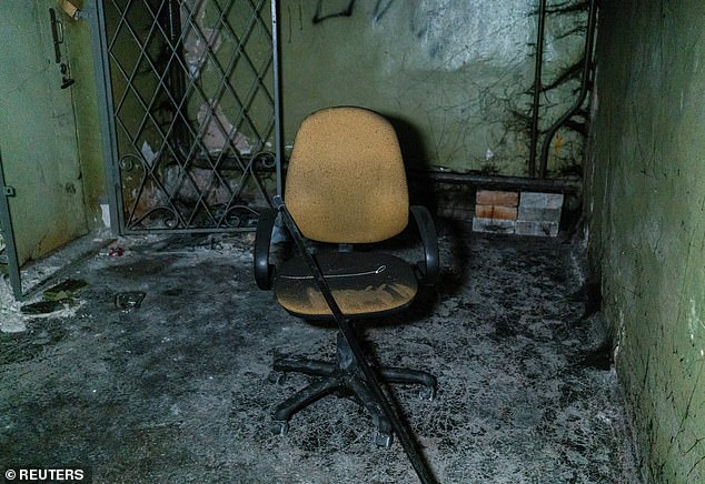 Plastic torture restraints and a broken chair are seen inside the basement of an office building, where prosecutors say 30 people were detained for two months during the Russian occupation, amid Russia's attack on Ukraine, in Kherson, Ukraine, December 10, 2022.
