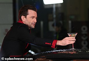 Balancing the martini on the roof of his Comic Relief Aston Martin, David made sure he would travel in style in the vehicle