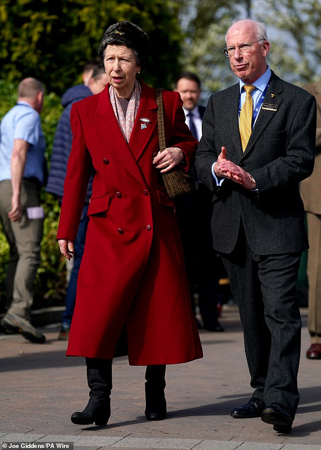 The Princess Royal paired her red coat with a Cossack-style hat adorned with a brooch