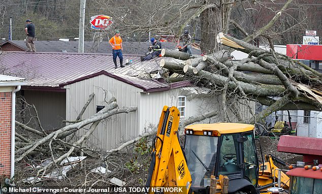 Crews work to clean up after a tornado touched down Thursday, March 14, 2024, in Milton, Kentucky