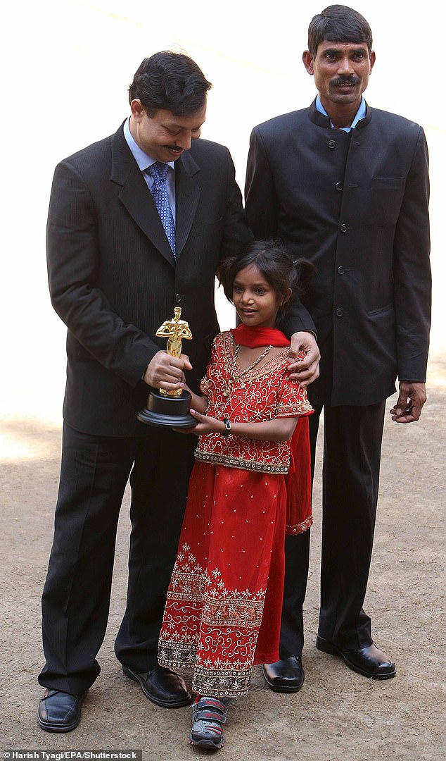 Pinki rose to fame after starring in the Oscar-winning documentary Smile Pinki (pictured at a press conference for the 2009 Oscars with the doctor who performed her surgery and her father)