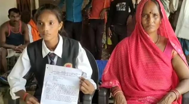 Pinki (left), along with 30 other residents living in her village, were told to leave their homes and were served with demolition notices last year.