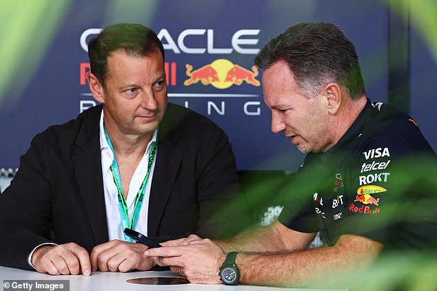 Horner is pictured speaking to Red Bull chief executive Franz Watzlawick at the Saudi Arabian Grand Prix after key stakeholders said the pit boss would not be sacked before the Australian GP