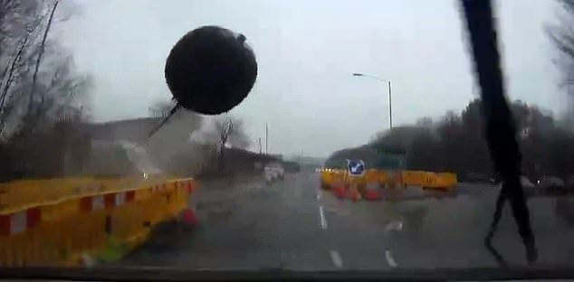 The ball goes straight towards the car, and a split second later it smashes into the windscreen of the engine, shattering the glass and the front completely.