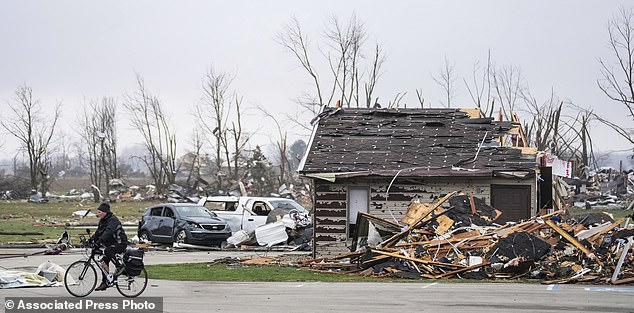 Homes and businesses are damaged after a violent storm overnight Friday, March 15, 2024, in Winchester, Ind.  Severe storms with suspected tornadoes have damaged homes and businesses in the central United States.  (Grace Hollars/The Indianapolis Star via AP)