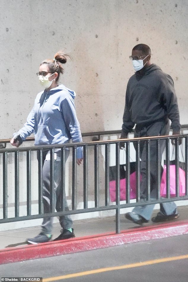 Foxx was spotted getting out of his car in the garage wearing a stunning sweatshirt and gray pants with a face mask covering his nose and mouth