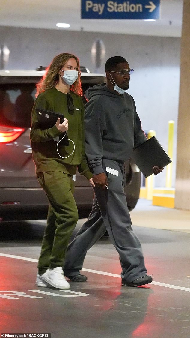 The Burial actor, 56, was joined by his longtime girlfriend Alyce Huckstepp for the heartfelt affair.  Alyce wore olive green cargo pants and a matching sweatshirt and a face mask as they walked to the entrance of the hospital