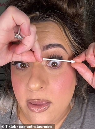 While her mascara was still wet, Taormina took the center of the Q-Tip and moved it around her lashes